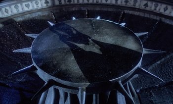 Movie still from “The Nightmare Before Christmas” (1993), directed by Henry Selick – A large metal object sitting inside of a building; Wide shot, Overhead angle