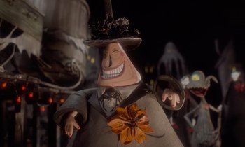 Movie still from “The Nightmare Before Christmas” (1993), directed by Henry Selick – A character in a costume with a flower; Close Up shot, Low angle