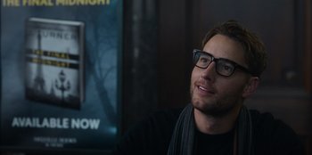 Movie still from “The Noel Diary” (2022), directed by Charles Shyer – A person wearing glasses; Close Up shot, Over the shoulder angle