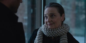 Movie still from “The Noel Diary” (2022), directed by Charles Shyer – A person wearing a scarf; Close Up shot, Over the shoulder angle