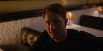 Movie still from “The Noel Diary” (2022), directed by Charles Shyer – A person sitting at a table; Close Up shot, Over the shoulder angle