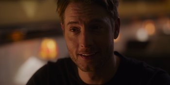 Movie still from “The Noel Diary” (2022), directed by Charles Shyer – A man's face in a dark room; Close Up shot, Over the shoulder angle