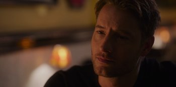 Movie still from “The Noel Diary” (2022), directed by Charles Shyer – A man's face in a dark room; Close Up shot, Over the shoulder angle