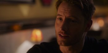 Movie still from “The Noel Diary” (2022), directed by Charles Shyer – A man's face in a dark room; Close Up shot, Over the shoulder angle