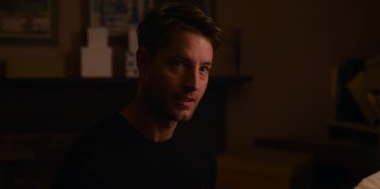 Movie still from “The Noel Diary” (2022), directed by Charles Shyer – A person wearing a black t - shirt; Close Up shot, Over the shoulder angle