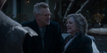 Movie still from “The Noel Diary” (2022), directed by Charles Shyer – An older man standing next to an older woman; Close Up shot, Over the shoulder angle