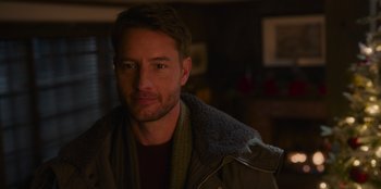 Movie still from “The Noel Diary” (2022), directed by Charles Shyer – A person wearing a jacket; Close Up shot, Over the shoulder angle