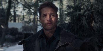 Movie still from “The Noel Diary” (2022), directed by Charles Shyer – A person wearing a jacket near a forest; Close Up shot, Over the shoulder angle