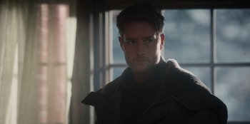 Movie still from “The Noel Diary” (2022), directed by Charles Shyer – A person wearing a jacket; Close Up shot, Over the shoulder angle