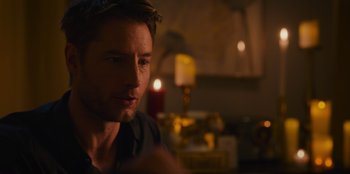 Movie still from “The Noel Diary” (2022), directed by Charles Shyer – A person in a room near a candle; Close Up shot, Over the shoulder angle