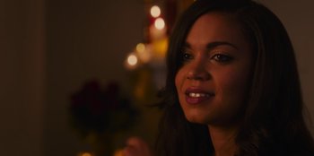 Movie still from “The Noel Diary” (2022), directed by Charles Shyer – A woman smiling for the camera; Close Up shot, Over the shoulder angle