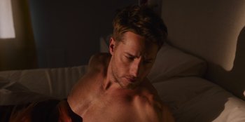 Movie still from “The Noel Diary” (2022), directed by Charles Shyer – A man with his arms crossed looking down at his chest; Close Up shot, Low angle