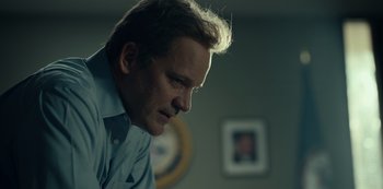 Movie still from “Dopesick” (2021), directed by Danny Strong – A person looking down at something; Close Up shot, Low angle