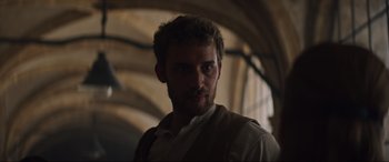 Movie still from “The Nun II” (2023), directed by Michael Chaves – A person wearing a white shirt; Close Up shot, Low angle