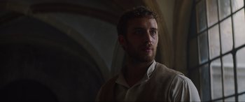 Movie still from “The Nun II” (2023), directed by Michael Chaves – A person wearing a vest; Close Up shot, Low angle