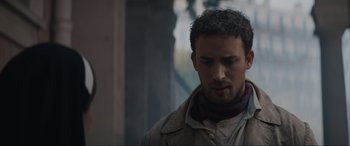 Movie still from “The Nun II” (2023), directed by Michael Chaves – A person wearing a jacket; Close Up shot, Low angle