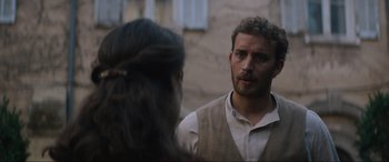 Movie still from “The Nun II” (2023), directed by Michael Chaves – A man and a woman are talking to each other; Close Up shot, Over the shoulder angle