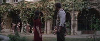 Movie still from “The Nun II” (2023), directed by Michael Chaves – A man and a woman standing next to each other; Wide shot, Over the shoulder angle