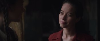 Movie still from “The Nun II” (2023), directed by Michael Chaves – A person wearing a red shirt; Close Up shot, Over the shoulder angle