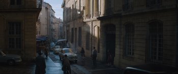 Movie still from “The Nun II” (2023), directed by Michael Chaves – A group of people walking down a street; Extreme Wide shot, High angle