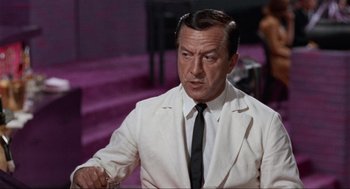 Movie still from “The Nutty Professor” (1963), directed by Jerry Lewis – A person wearing a suit and tie; Close Up shot, Over the shoulder angle