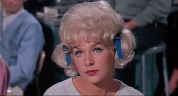 Movie still from “The Nutty Professor” (1963), directed by Jerry Lewis – A person with a blonde wig; Close Up shot, High angle