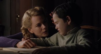 Movie still from “The Others” (2001), directed by Alejandro Amenábar – A woman and a child are sitting together; Close Up shot, Over the shoulder angle