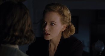 Movie still from “The Others” (2001), directed by Alejandro Amenábar – A woman in a black shirt is talking to another woman; Close Up shot, Over the shoulder angle