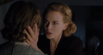 Movie still from “The Others” (2001), directed by Alejandro Amenábar – A woman is looking at a man with a ring; Close Up shot, Over the shoulder angle