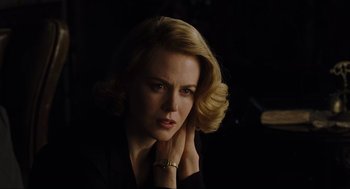 Movie still from “The Others” (2001), directed by Alejandro Amenábar – A beautiful woman with blonde hair wearing a black shirt; Close Up shot, Over the shoulder angle