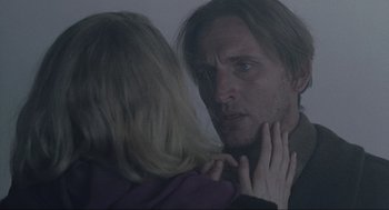 Movie still from “The Others” (2001), directed by Alejandro Amenábar – A man and a woman looking at each other in a mirror; Close Up shot, Over the shoulder angle