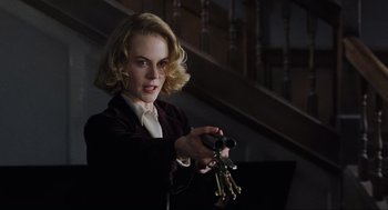 Movie still from “The Others” (2001), directed by Alejandro Amenábar – A woman holding a bunch of keys in her hand; Close Up shot, Over the shoulder angle