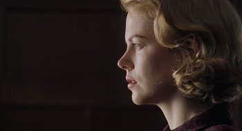 Movie still from “The Others” (2001), directed by Alejandro Amenábar – A woman with blonde hair looking to the side; Close Up shot, Over the shoulder angle