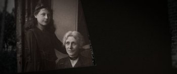 Movie still from “The Pigeon Tunnel” (2023), directed by Errol Morris – An old photo of an older woman getting her hair done; Close Up shot, Low angle