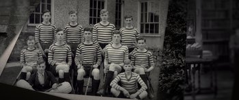 Movie still from “The Pigeon Tunnel” (2023), directed by Errol Morris – A black and white photo of a group of young men; Wide shot, High angle