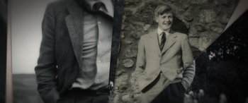 Movie still from “The Pigeon Tunnel” (2023), directed by Errol Morris – A black and white photo of a man in a suit and tie; Extreme Close Up shot, High angle