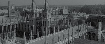 Movie still from “The Pigeon Tunnel” (2023), directed by Errol Morris – An aerial view of a city with many buildings; Extreme Wide shot, High angle