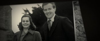 Movie still from “The Pigeon Tunnel” (2023), directed by Errol Morris – An old black and white photo of a man and a woman; Medium shot, High angle