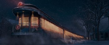 Movie still from “The Polar Express” (2004), directed by Robert Zemeckis – A train traveling down train tracks at night time; Extreme Wide shot, Low angle