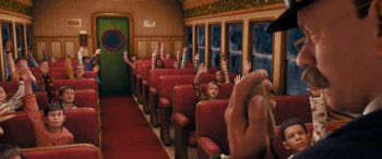 Movie still from “The Polar Express” (2004), directed by Robert Zemeckis – A group of people sitting in a train car; Extreme Wide shot, High angle
