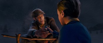 Movie still from “The Polar Express” (2004), directed by Robert Zemeckis – A man and a boy shaking hands in the rain; Medium shot, High angle