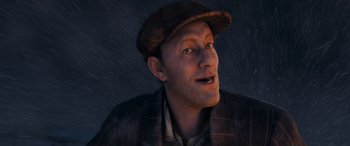 Movie still from “The Polar Express” (2004), directed by Robert Zemeckis – A man wearing a brown hat and a brown jacket; Close Up shot, High angle