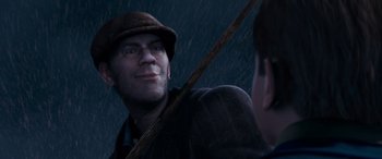 Movie still from “The Polar Express” (2004), directed by Robert Zemeckis – A man with a hat is looking at himself in the mirror; Close Up shot, Low angle