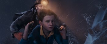 Movie still from “The Polar Express” (2004), directed by Robert Zemeckis – A boy and a man are in the rain; Close Up shot, High angle