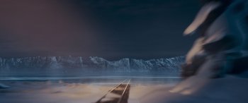 Movie still from “The Polar Express” (2004), directed by Robert Zemeckis – A view of a train track with a mountain in the background; Extreme Wide shot, High angle