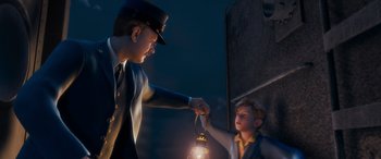 Movie still from “The Polar Express” (2004), directed by Robert Zemeckis – A man in a uniform handing a light to a boy; Medium shot, Over the shoulder angle