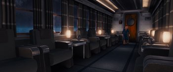 Movie still from “The Polar Express” (2004), directed by Robert Zemeckis – A row of seats in a train car at night; Extreme Wide shot, High angle