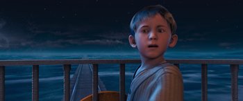 Movie still from “The Polar Express” (2004), directed by Robert Zemeckis – A young boy standing in front of a rail road track; Medium shot, High angle