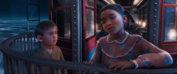 Movie still from “The Polar Express” (2004), directed by Robert Zemeckis – Two young children standing next to each other on a train; Close Up shot, Over the shoulder angle