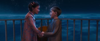 Movie still from “The Polar Express” (2004), directed by Robert Zemeckis – A boy and a girl are shaking hands outside; Medium shot, High angle